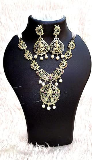 Gold-plated, pearl, and green stone necklace set