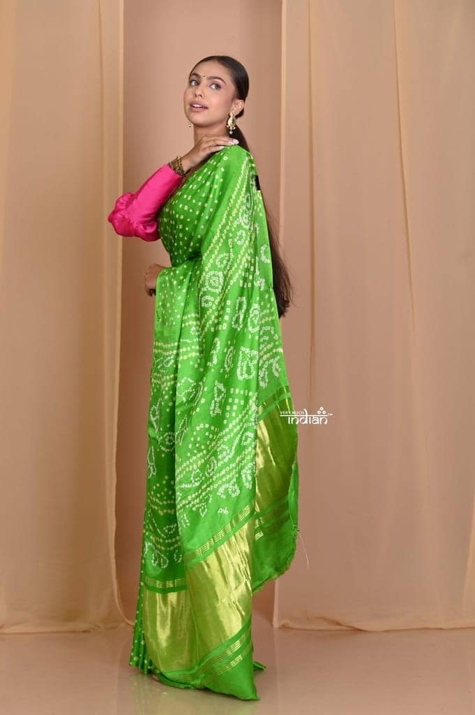 Pehal~ Traditional Blade Green Gajji silk Saree with Golden Bandhani Weave. view 2