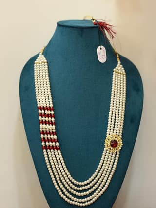 rajwadi dulha haar featuring royal round side brooch with maroon stone