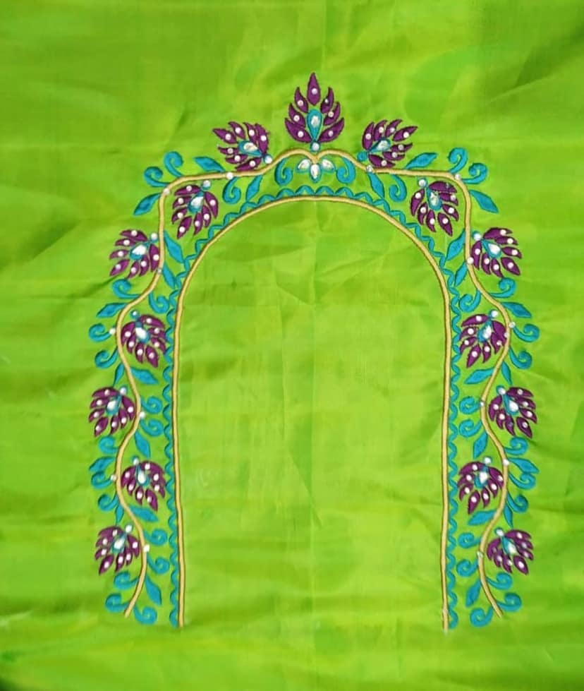Green blouse with floral embroidery