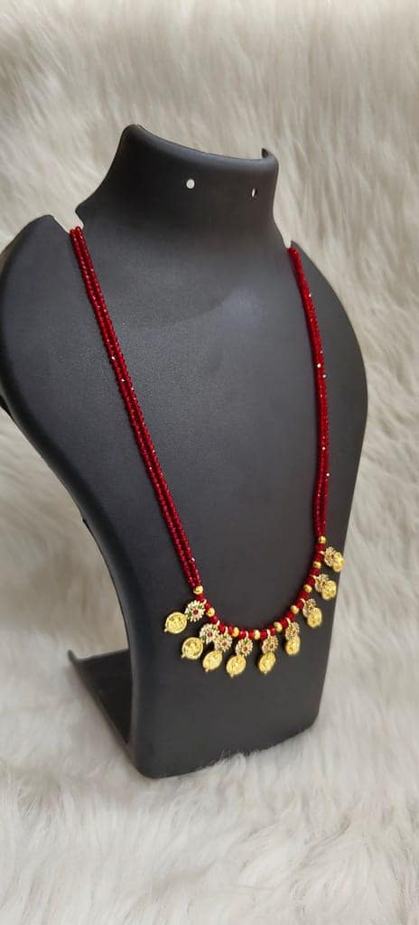 Delicate and elegant gold-plated long necklace with red beads and intricate detailing, perfect for any occasion. view 2
