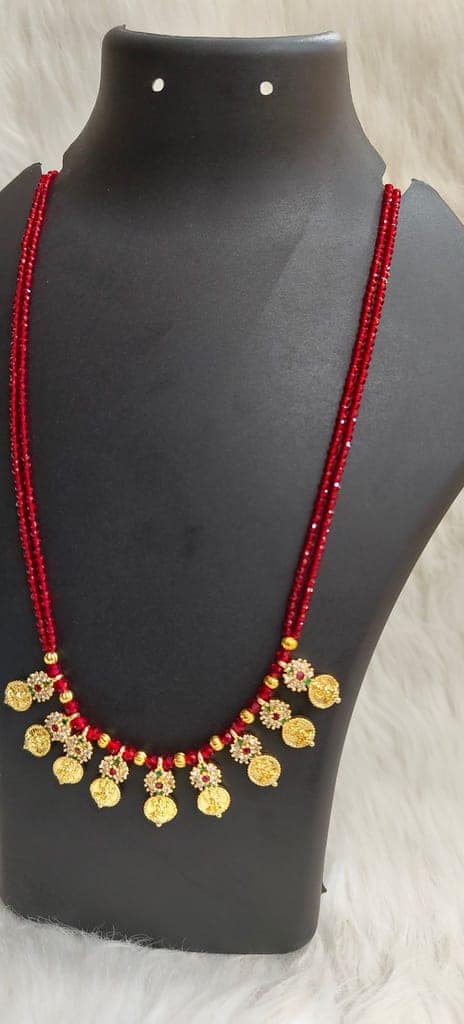 Delicate and elegant gold-plated long necklace with red beads and intricate detailing, perfect for any occasion. view 4