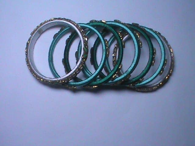 Seafoam green and gold bangles view 2