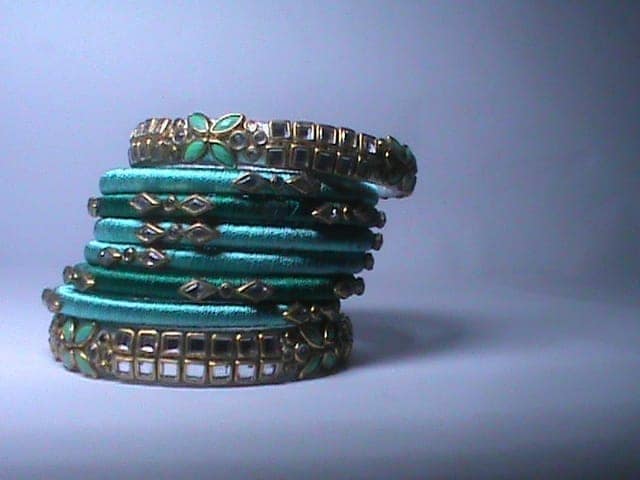 Seafoam green and gold bangles view 3
