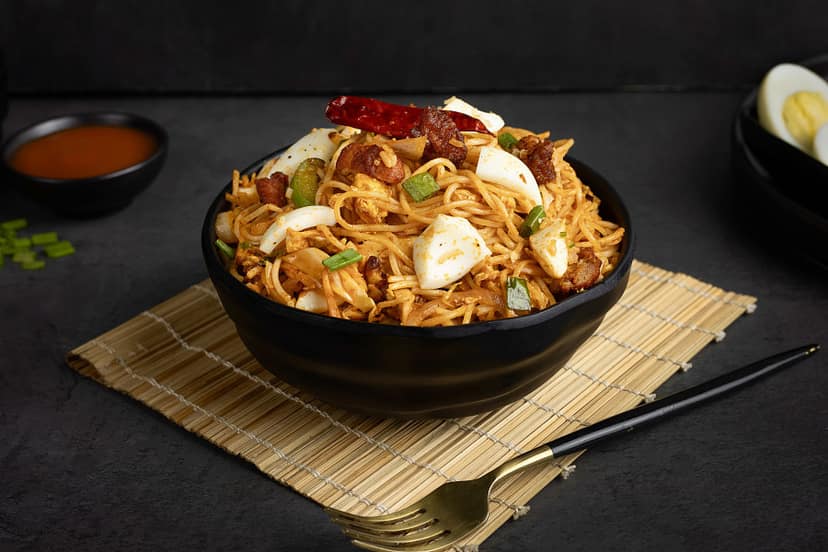Boiled egg schezwan chicken noodles