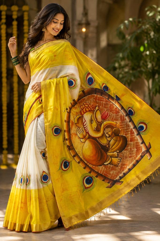 Luxury Kerala Kasavu Cotton Saree | Hand Painted Lord Ganesha with Peacock Motifs & Designer Pallu | Multicolor Ethnic Saree with Golden Zari Border & Running Blouse I Traditional Ethnic Indian Saree | Festive & Occasion Wear