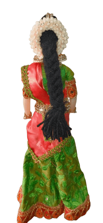 Traditional Indian decorative half saree doll in green and orange view 2