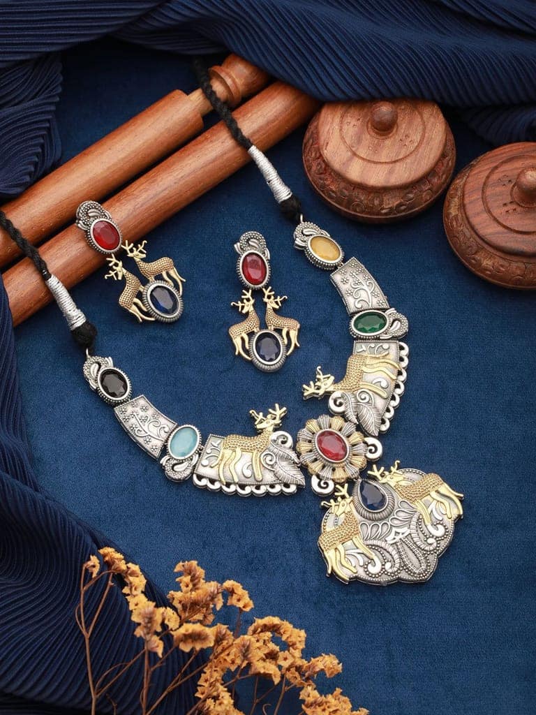 Dual Toned Oxidised Red Stone Studded Brass Handcrafted Deer Motif Intricate Designer Jewellery Set view 2