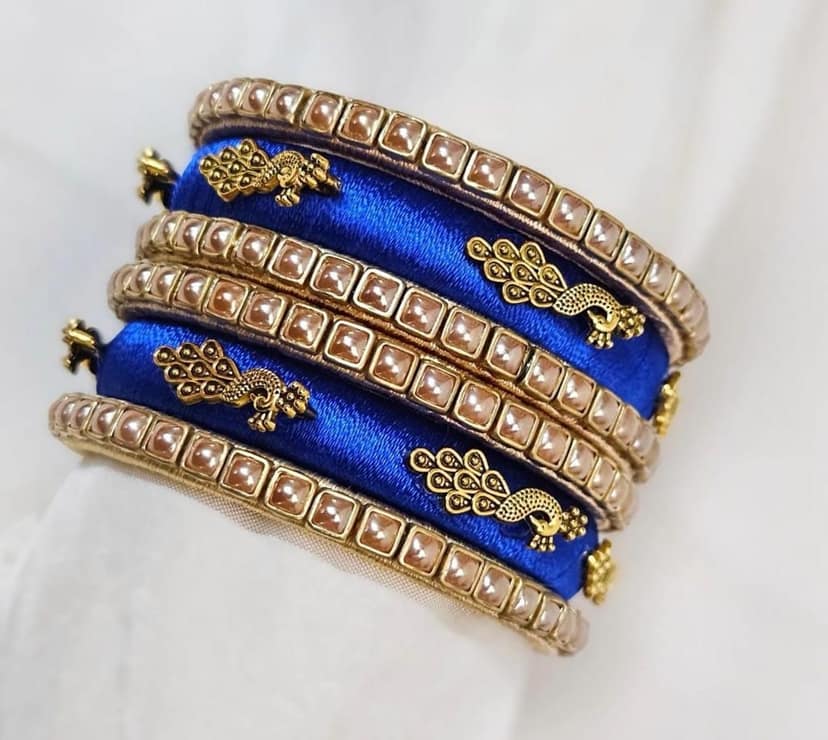 Set of 6 Blue Silk Thread Bangles with Golden Peacock Design and Pearl Beads view 2