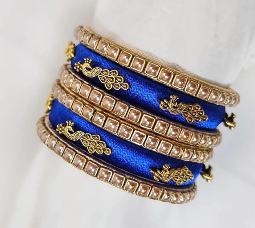 Set of 6 Blue Silk Thread Bangles with Golden Peacock Design and Pearl Beads view 3