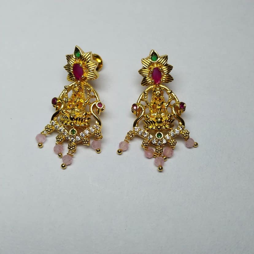 Gold Goddess Lakshmi Hanging Jhumka Earrings With Ruby and White Stones