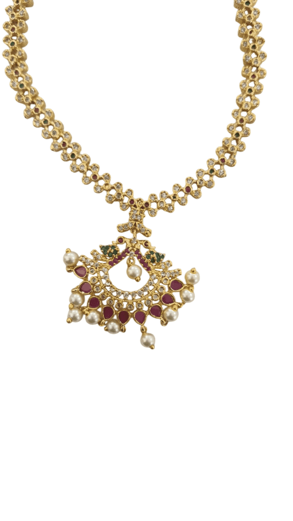 Gold-plated traditional Indian necklace set with intricate detailing and pearl drops, perfect for special occasions view 2