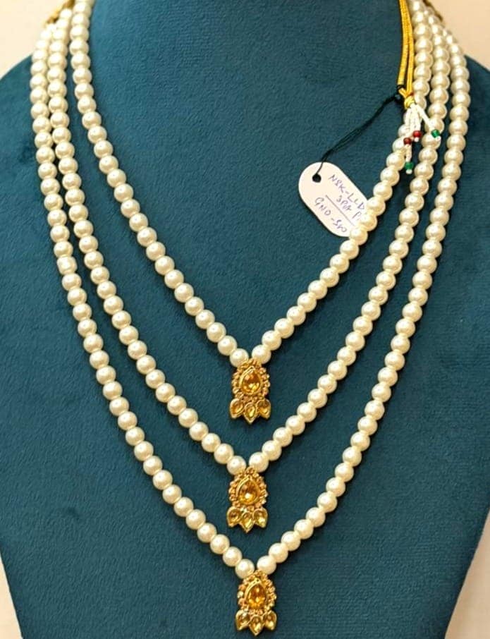 three-layer white moti pearl necklace with golden stone pendants view 3