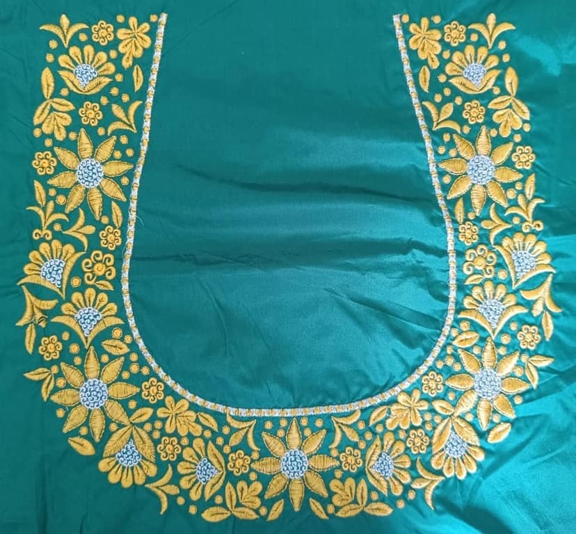Green blouse with intricate golden embroidery