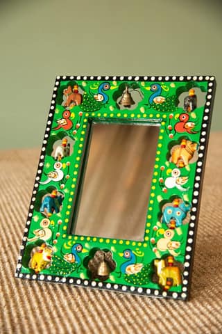 Handcrafted Wooden Mirror Frame with Intricate Animal and Bell Design