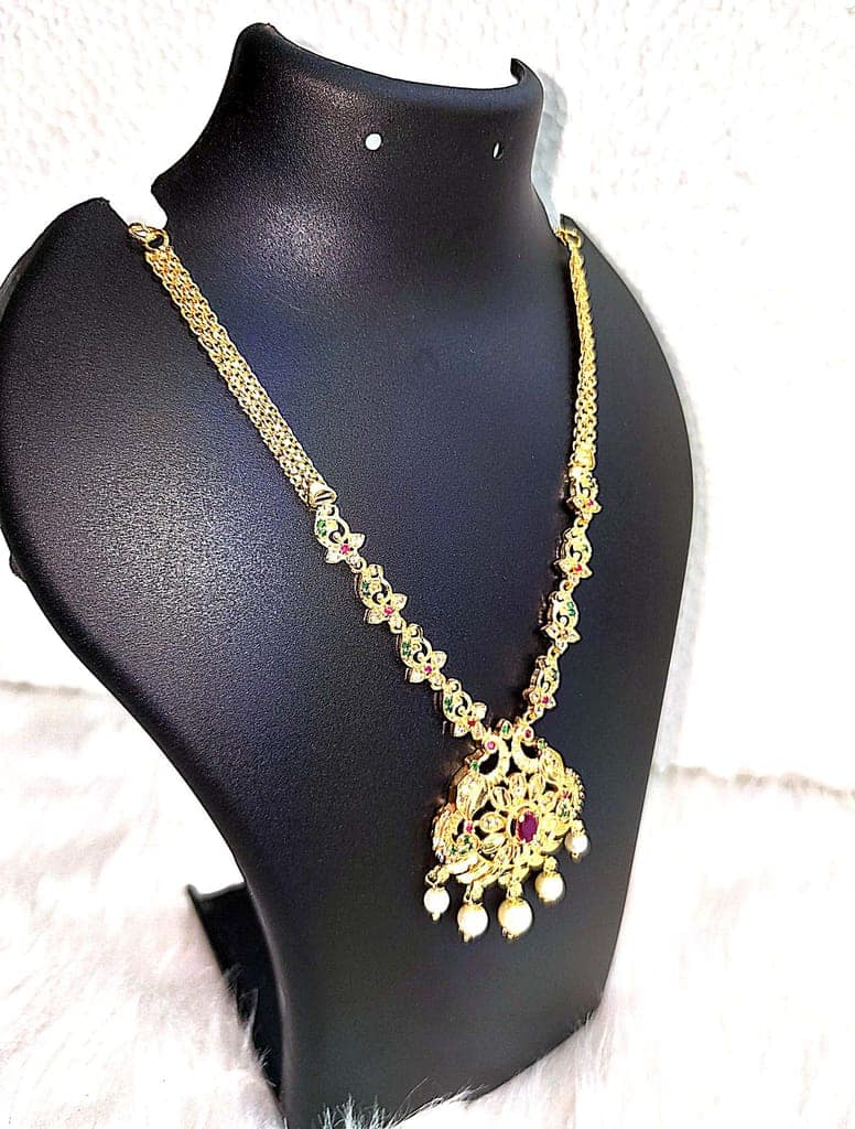 "Stunning Gold-Plated Necklace with Intricate Peacock Pendant and Pearl Drop Detailing" view 4