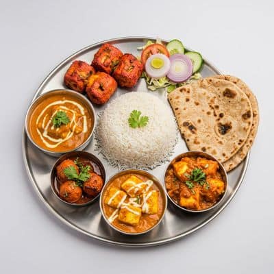 Paneer Tikka (2pc) + Paneer Butter Masala Or Kadai Paneer With Tandoori Roti (2pc) Or Rice + Salad + Dessert