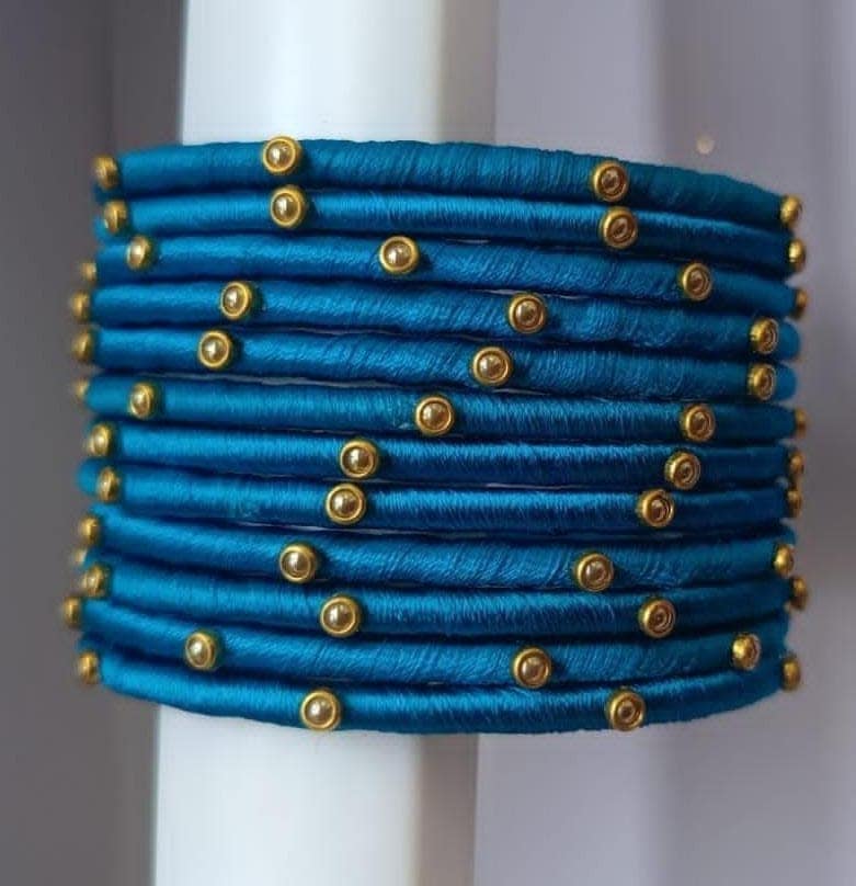 Set of 12 Blue Silk Thread Bangles with Golden Beads view 2