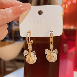 Elegant Gold Tone Hoop Dangle Earrings with Crystal Bow & Iridescent Pearl Drop
