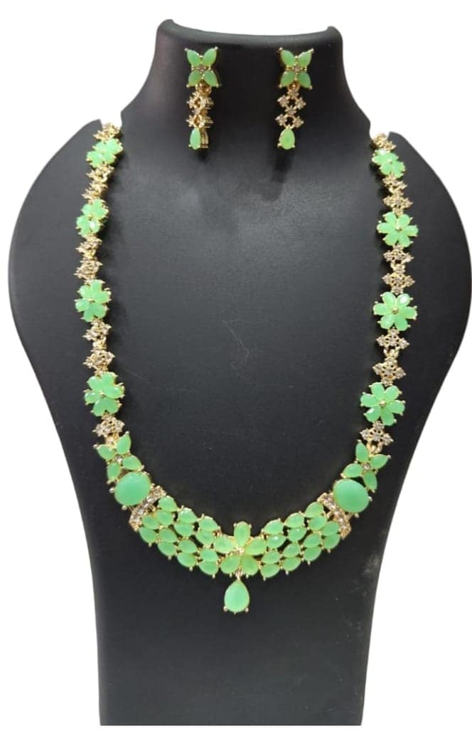 "Stunning Green Stone Necklace Set with Intricate Gold Detailing"