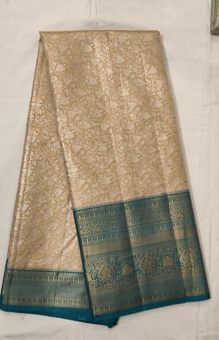 Cream Gold Zari Saree with Teal Border