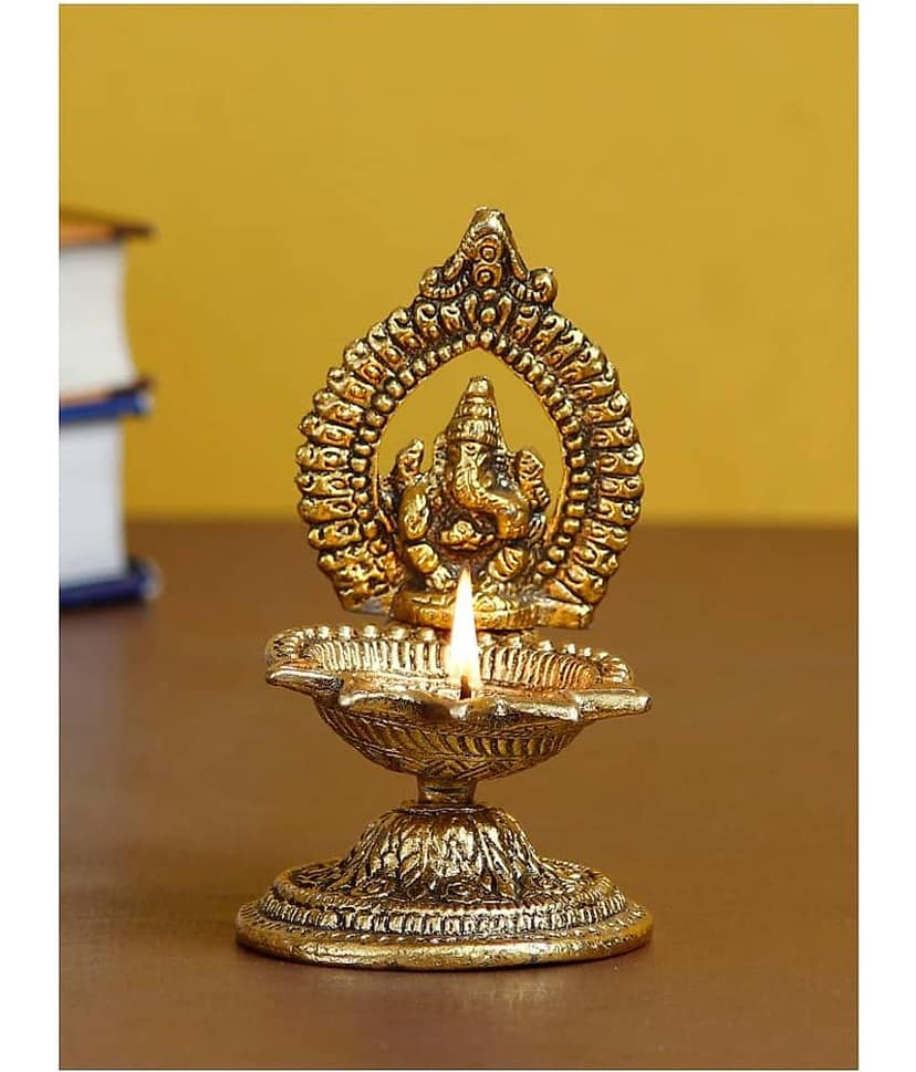 eCraftIndia Gold-Toned Lord Ganesha With Diya Handcrafted Showpiece