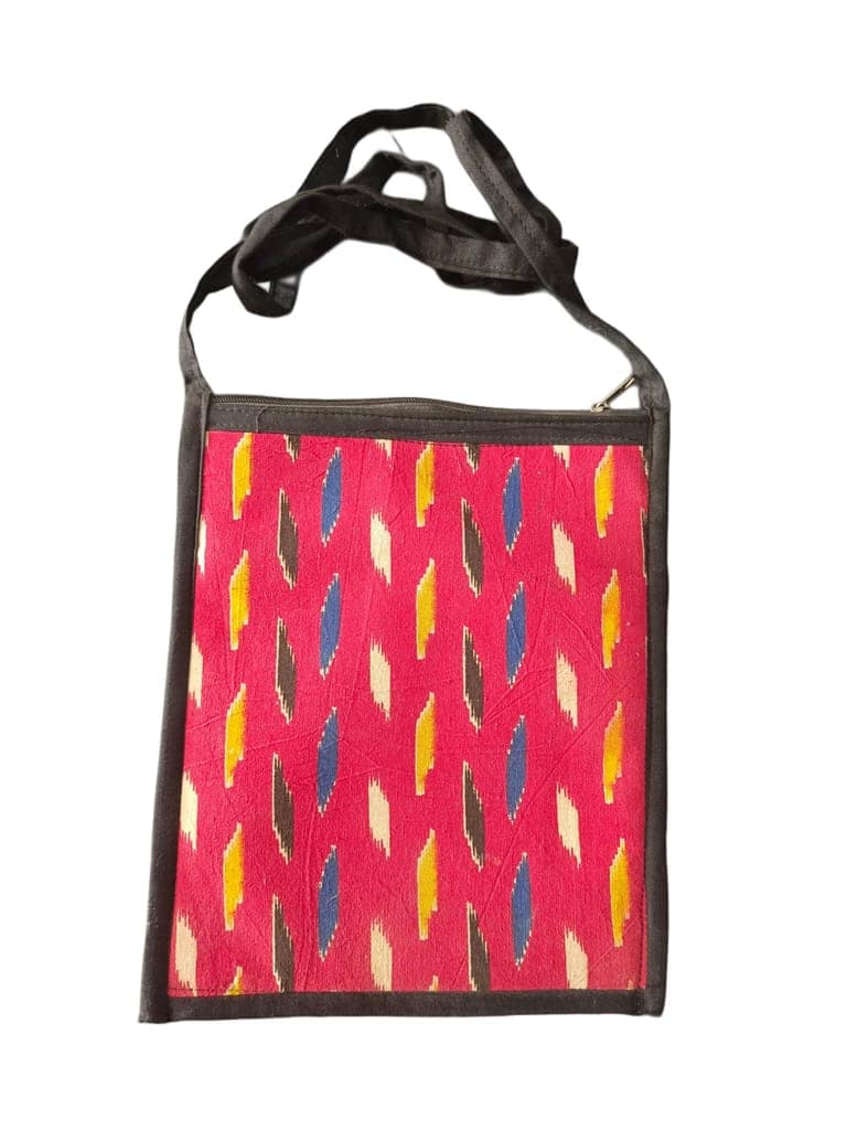 Handwoven ikat sling bag with adjustable strap and zippered closure view 2