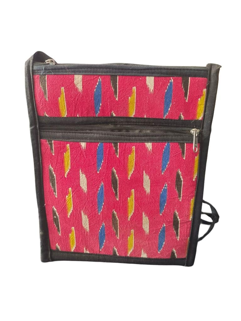Handwoven ikat sling bag with adjustable strap and zippered closure view 3