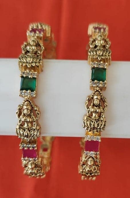 Gold Plated Goddess Laxmi Engraved Bangle Set with Green and Pink Stones