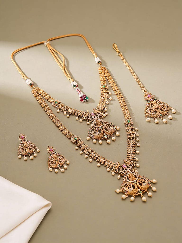 Combo Gold Plated White AD & Pearl Studded Temple Lakshmiji Bridal Jewellery Set view 3