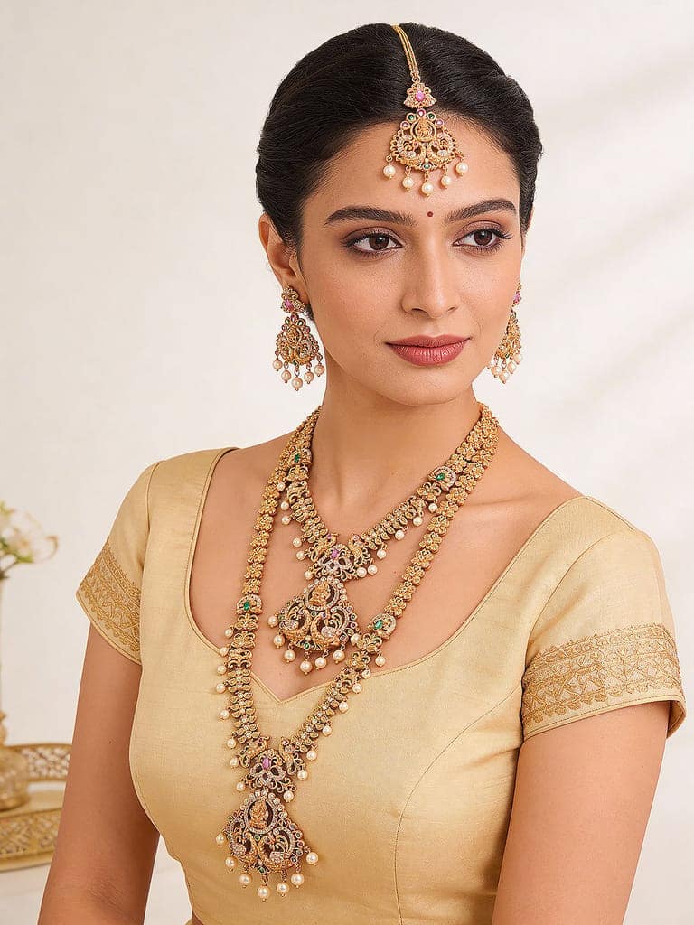 Combo Gold Plated White AD & Pearl Studded Temple Lakshmiji Bridal Jewellery Set view 4