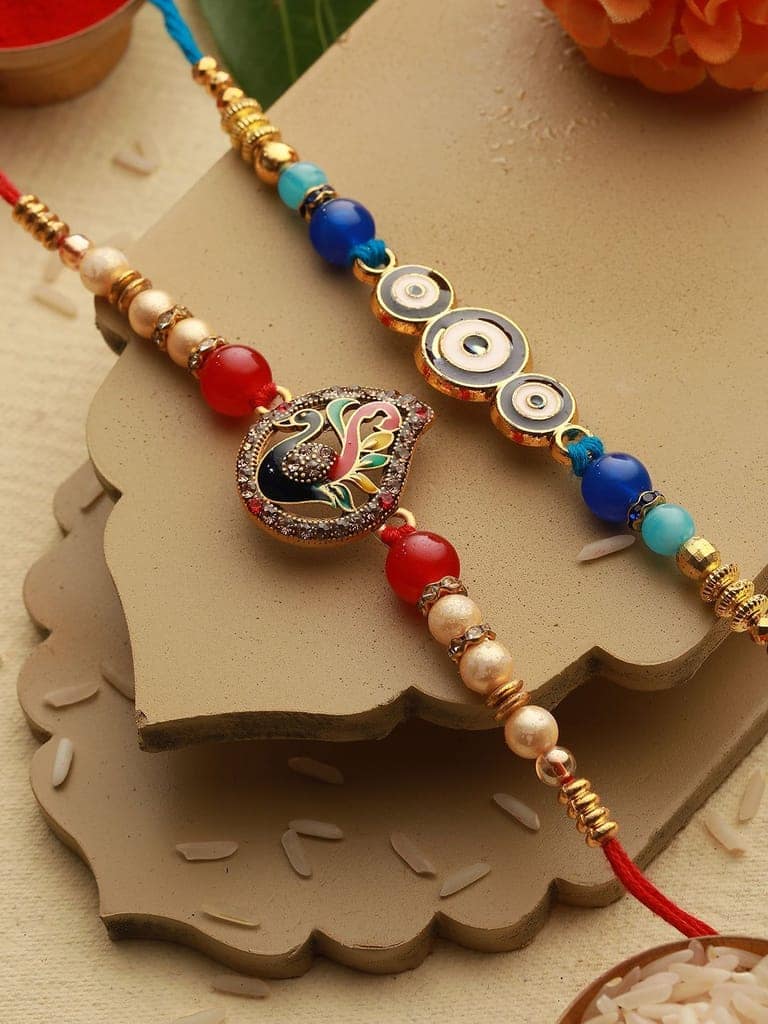 Set of 2 Evil Eye nd Peacock Rakhi with 10 gram Laxmi Ganesh round 999 Round Silver Coin view 2