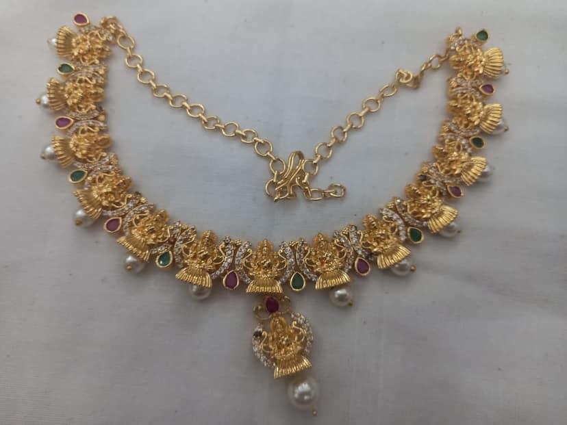 "Stunning Lakshmi Temple Jewelry Set in Gold with Pearls and Green Stones" view 2