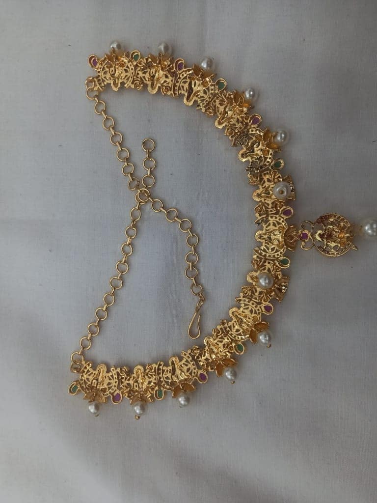 "Stunning Lakshmi Temple Jewelry Set in Gold with Pearls and Green Stones" view 3