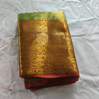 Green and gold zari woven Kanjivaram silk saree with blouse piece