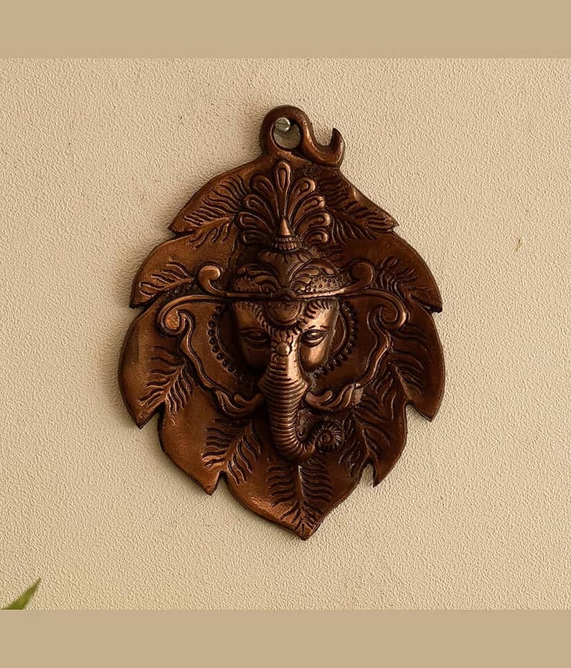 eCraftIndia Metal wall hanging of Lord Ganesha Head on Creative Leaf view 2