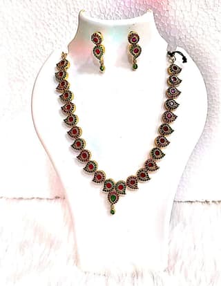 Gold-plated traditional Indian necklace set with rubies and emeralds