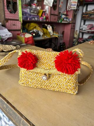 Handwoven Straw Sling Bag with Red Pom-Poms