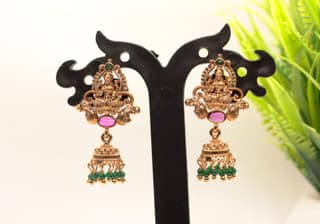 Gold Plated Goddess Lakshmi Antique Jhumka Earrings With Green Stones