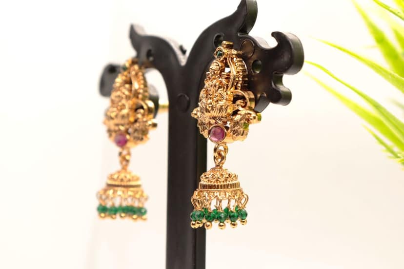 Gold Plated Goddess Lakshmi Antique Jhumka Earrings With Green Stones view 2