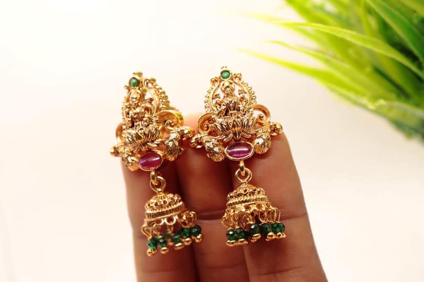 Gold Plated Goddess Lakshmi Antique Jhumka Earrings With Green Stones view 3