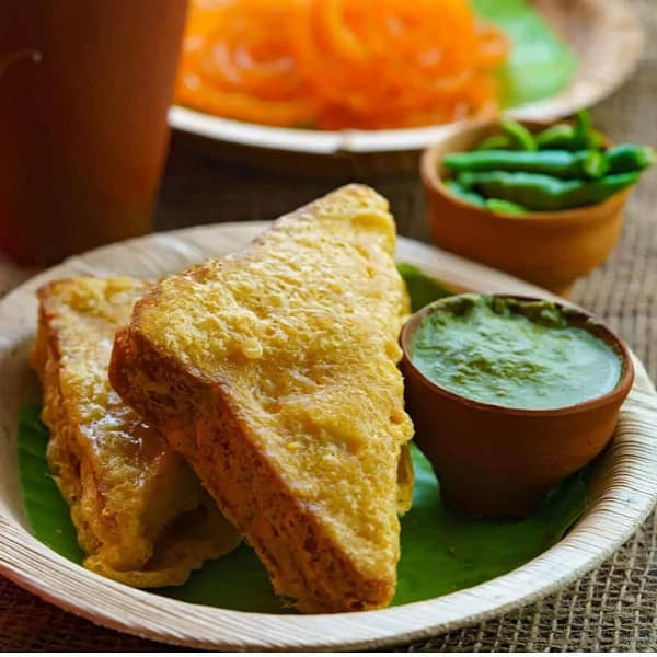 Stuffed bread pakodas.[2 triangles]