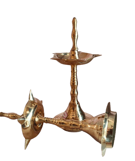A pair of brass oil lamps with a traditional design
