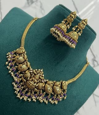 Gold-plated antique finish necklace set with purple stones and pearls