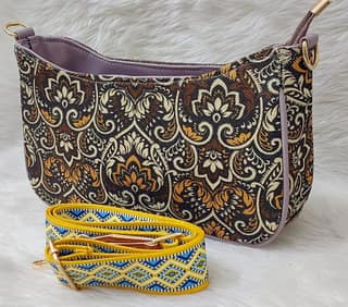 Brown and yellow floral print jute crossbody bag with adjustable strap