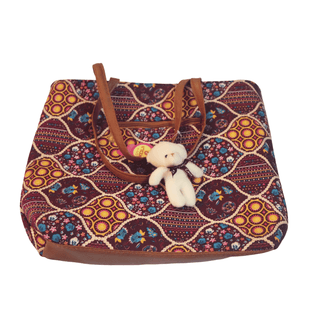 Tote bag with cute teddy bear pendant, perfect for everyday use