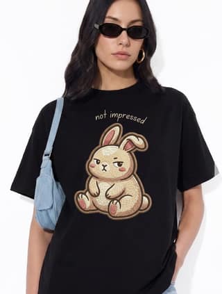 The Retro India Women’s Oversized Black Cotton T-Shirt “Not Impressed” Cute Bunny Graphic Print | Funny Attitude Tee | Trendy Loose Fit Stylish Casual Tshirt for Women