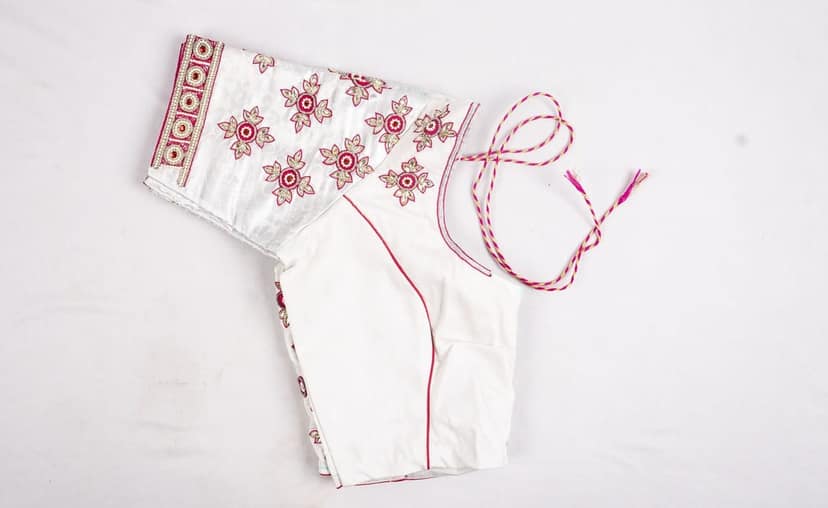 White cotton blouse with hand embroidered silver zari and pink thread work view 3