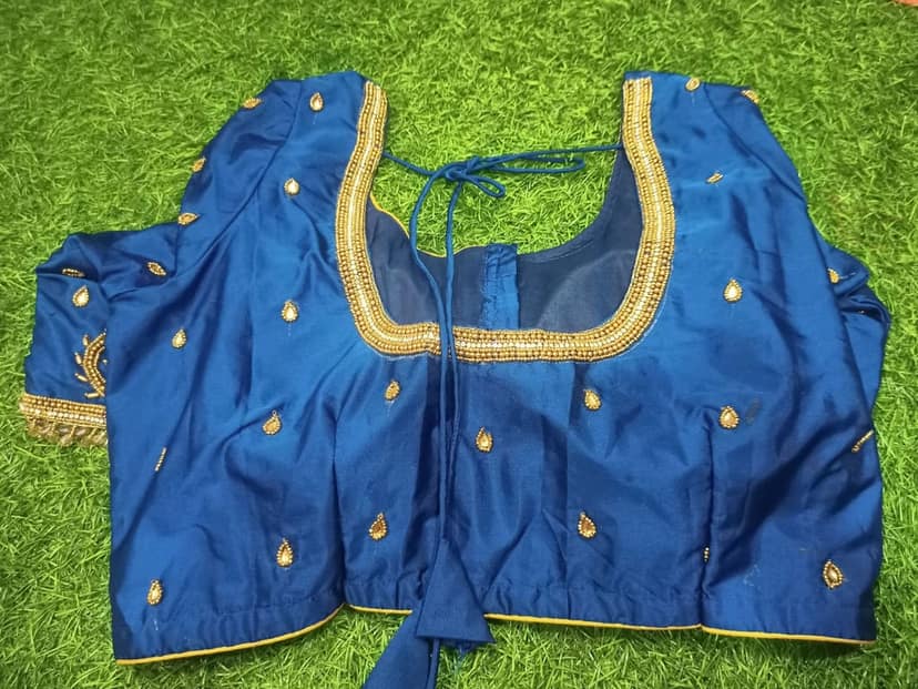 Blue blouse with intricate golden embroidery and mirror work view 3