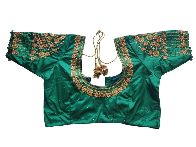 Green blouse with intricate zari embroidery and mirror work